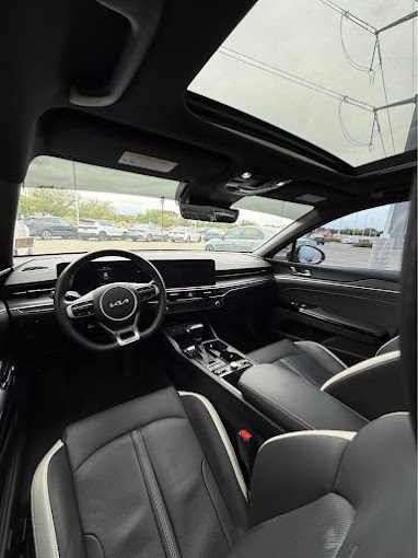 Kia K5 front interior detailed with panoramic sunroof