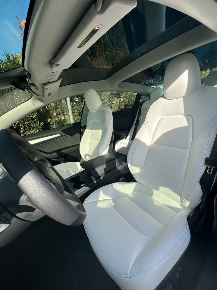 Tesla white leather front seats spotless after interior detail